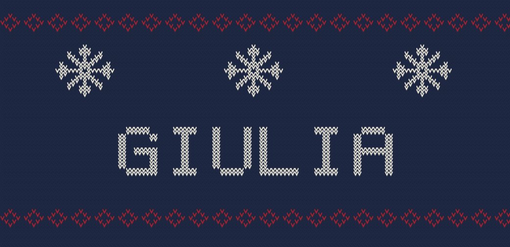 Simulazione a maglia: il nome Giulia in panna su fondo blu, fra fiocchi di neve e due fasce di rombetti rossi